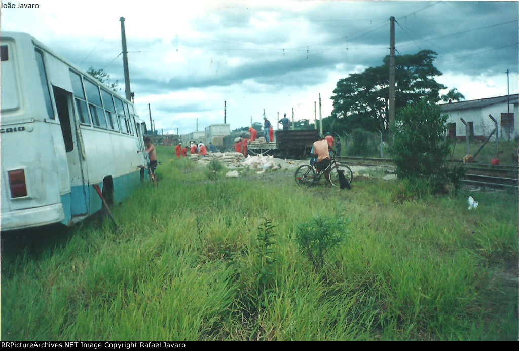 The rescue team reloading cement bags from derailed cars into new cars